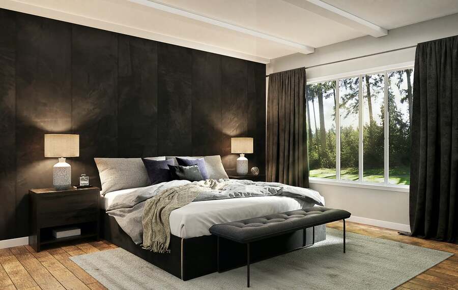 A luxurious bedroom with open blinds that let the sunshine and the view of nature in.