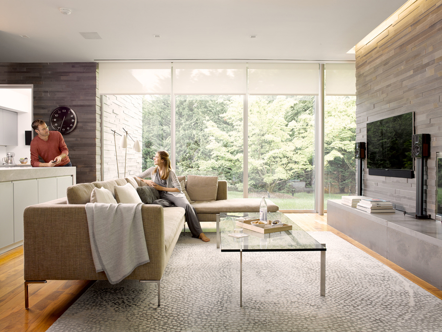 A couple having a conversation in their luxury living room.